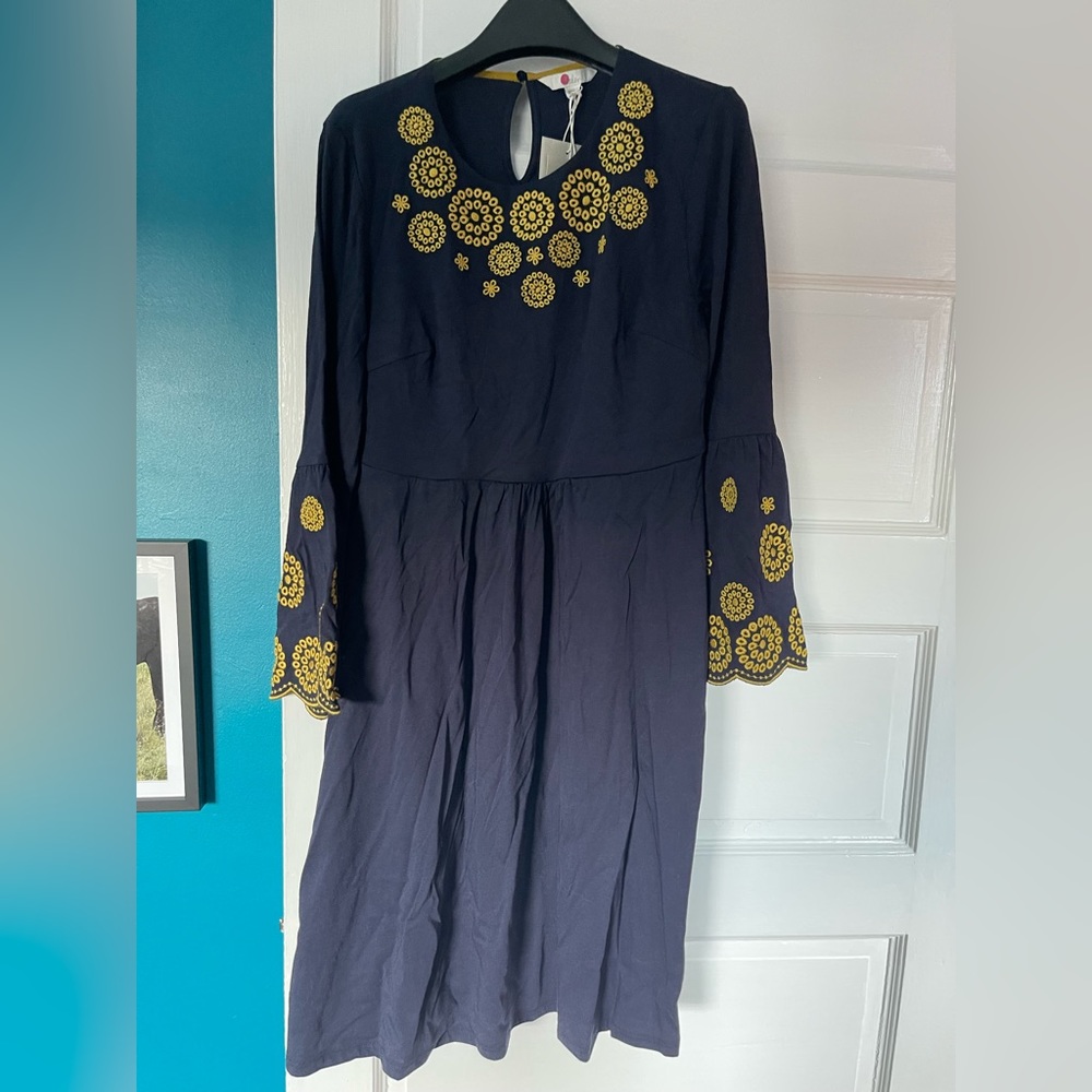 Navy dress with bright yellow-green embroidered detail from Boden